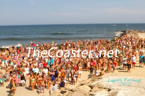 Allenhurst beach goers gathered for a photo op near the iconic lagoon and cove scheduled for removal later this year. Photo By The Coaster / Mike Booth